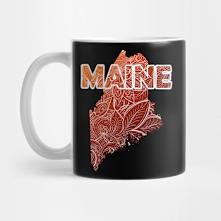 Colorful mandala art map of Maine with text in brown and orange Mug